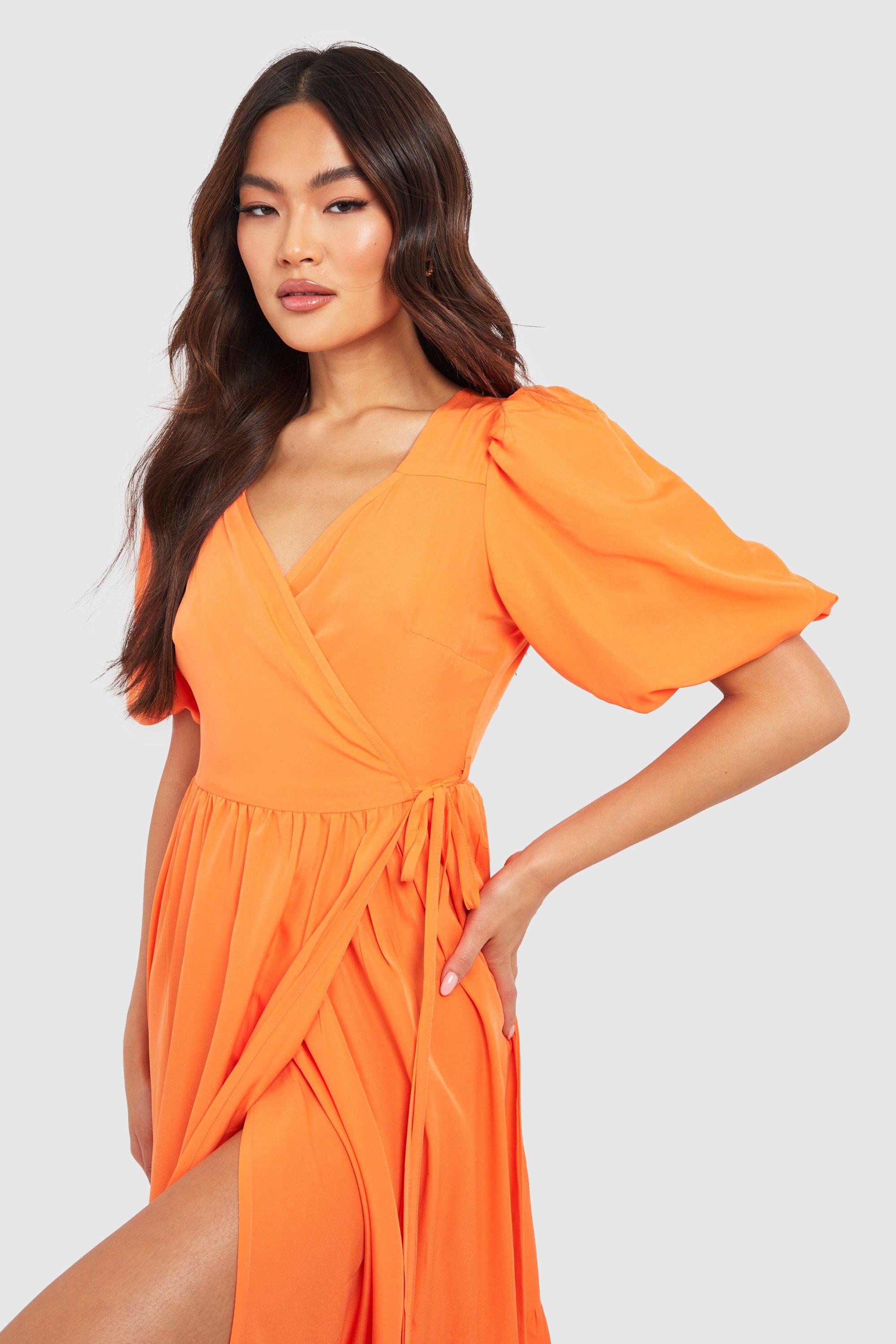 https://thebaeclub.in/cdn/shop/files/female-orange-wrap-puff-sleeve-midaxi-dress.jpg?v=1689852406